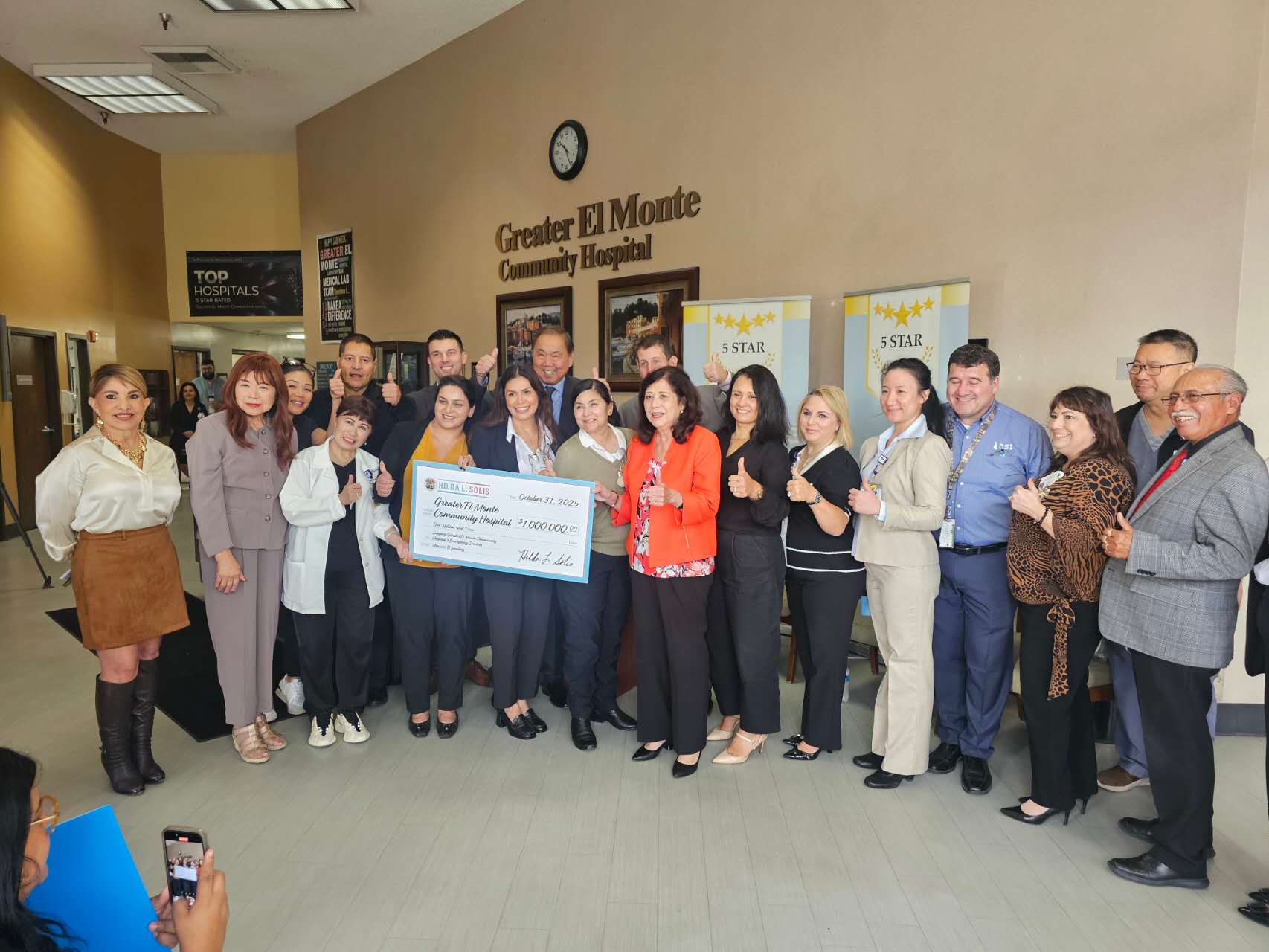 photo of hospital receiving check for 1 million