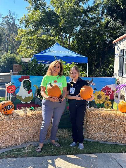 staff members in halloween costumes