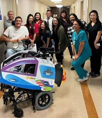 Pediatric Subacute Unit Staff posing with a donation wheelchair costume from Raytheon Technologies